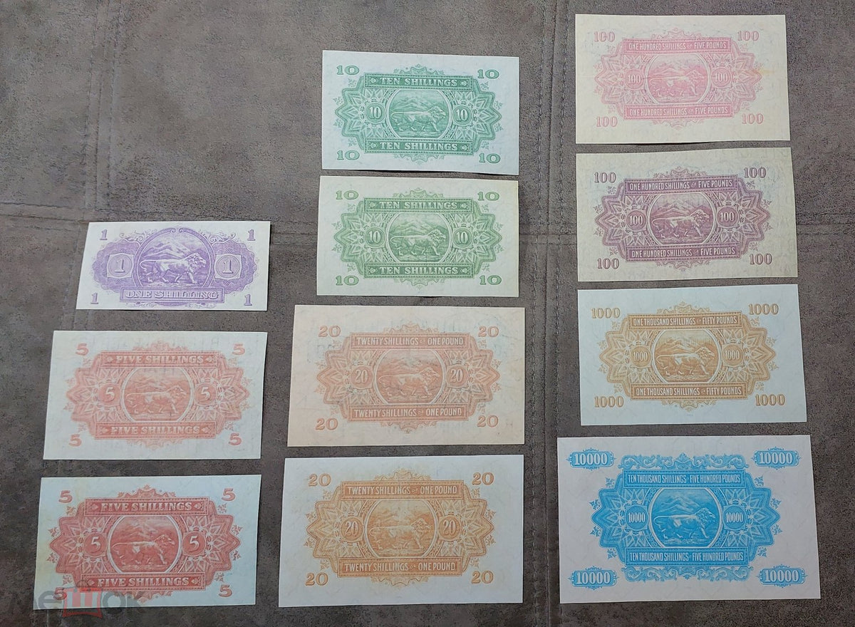Complete lot overview showcasing all 11 historical East African Shilling banknotes (1938–1952) displayed together back