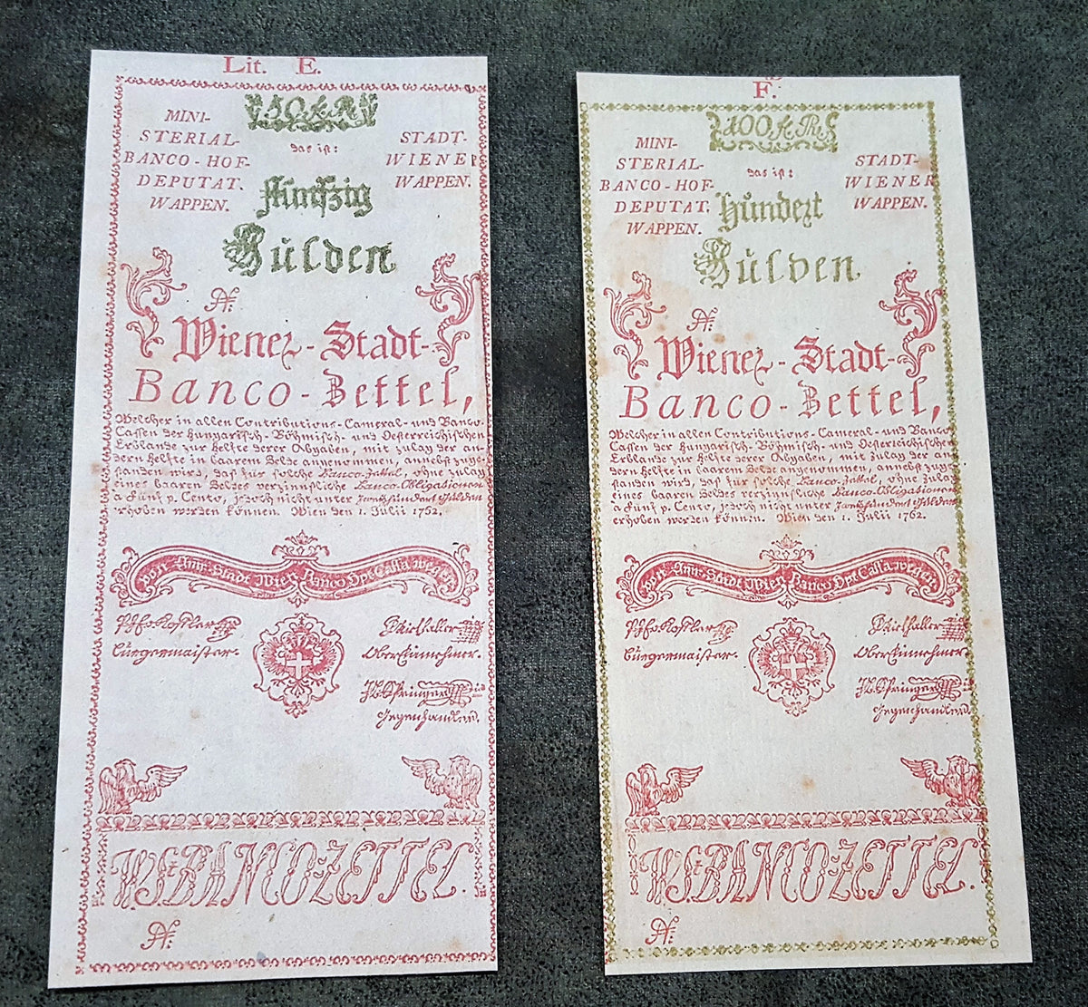 Obverse view of the rare high-denomination Austria 1762 50 Gulden and 100 Gulden currency certificates. Displays spectacular early red security tint accents and premium fine-line intaglio engraving layout.