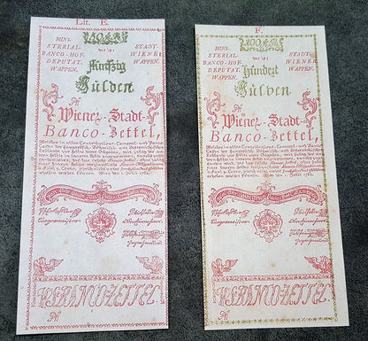 Obverse view of the rare high-denomination Austria 1762 50 Gulden and 100 Gulden currency certificates. Displays spectacular early red security tint accents and premium fine-line intaglio engraving layout.