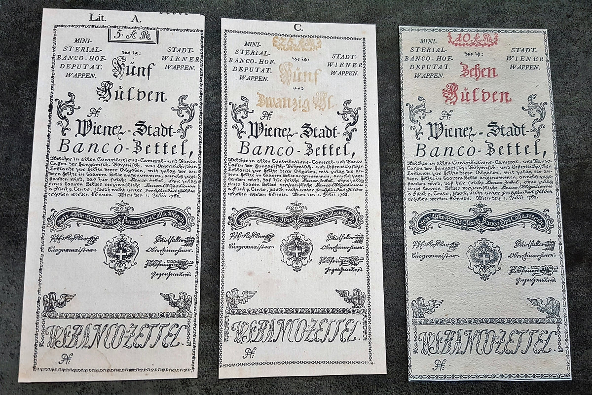 Obverse presentation of the 1762 series Austria Gulden treasury notes. Exhibits intricate early Austrian empire calligraphic scripts, traditional security border lathe work, and official financial signature blocks.