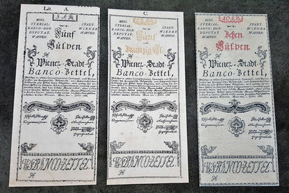 Obverse presentation of the 1762 series Austria Gulden treasury notes. Exhibits intricate early Austrian empire calligraphic scripts, traditional security border lathe work, and official financial signature blocks.