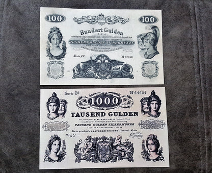 Obverse layout of the rare high-denomination Austria 1847 100 Gulden and 1000 Tausend Gulden treasury notes. Displays complex fine-line copperplate engraving frames and deep ink contrast.