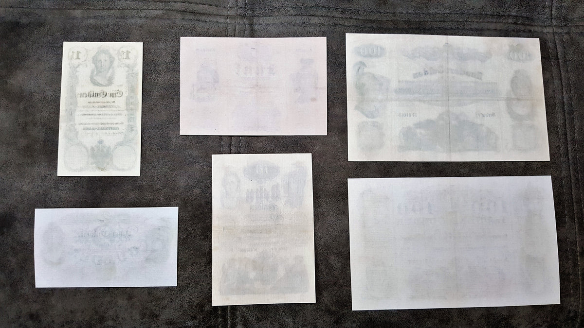 Reverse texture and uniface backing details of Austrian Empire 1847-1848 Gulden bank notes. Showcases traditional numismatic document paper fibers and early anti-counterfeiting ink bleed-through profiles.