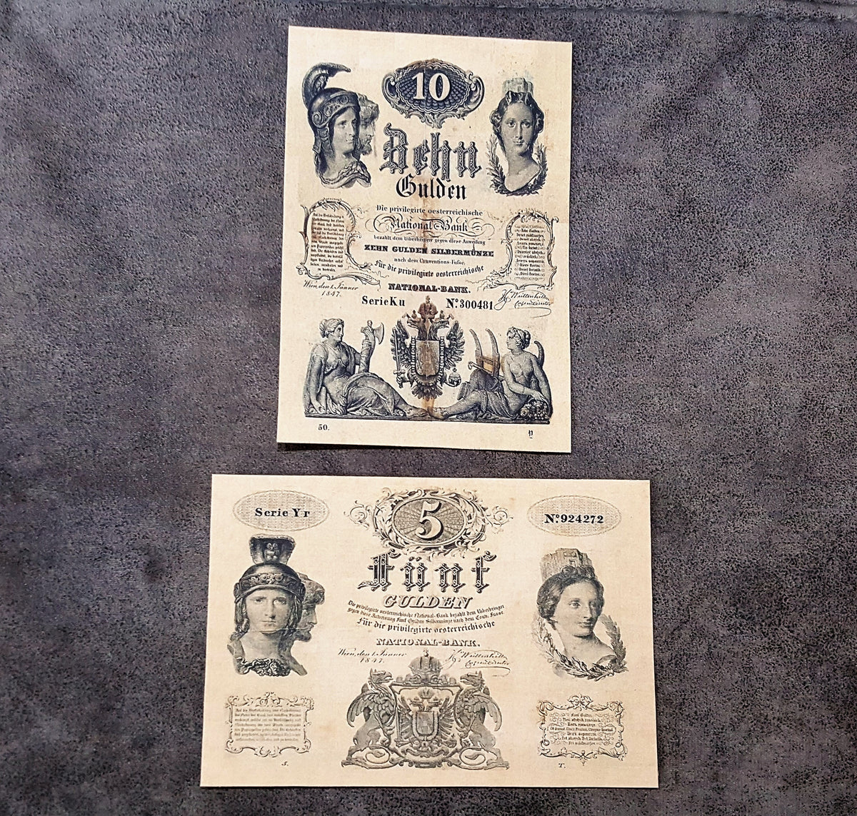 Obverse presentation of the 1847 Austrian Imperial Treasury 5 Gulden and 10 Gulden bank notes. Exhibits intricate baroque security frames, heraldic double-headed eagle crests, and vintage official signatures.