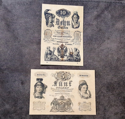 Obverse presentation of the 1847 Austrian Imperial Treasury 5 Gulden and 10 Gulden bank notes. Exhibits intricate baroque security frames, heraldic double-headed eagle crests, and vintage official signatures.