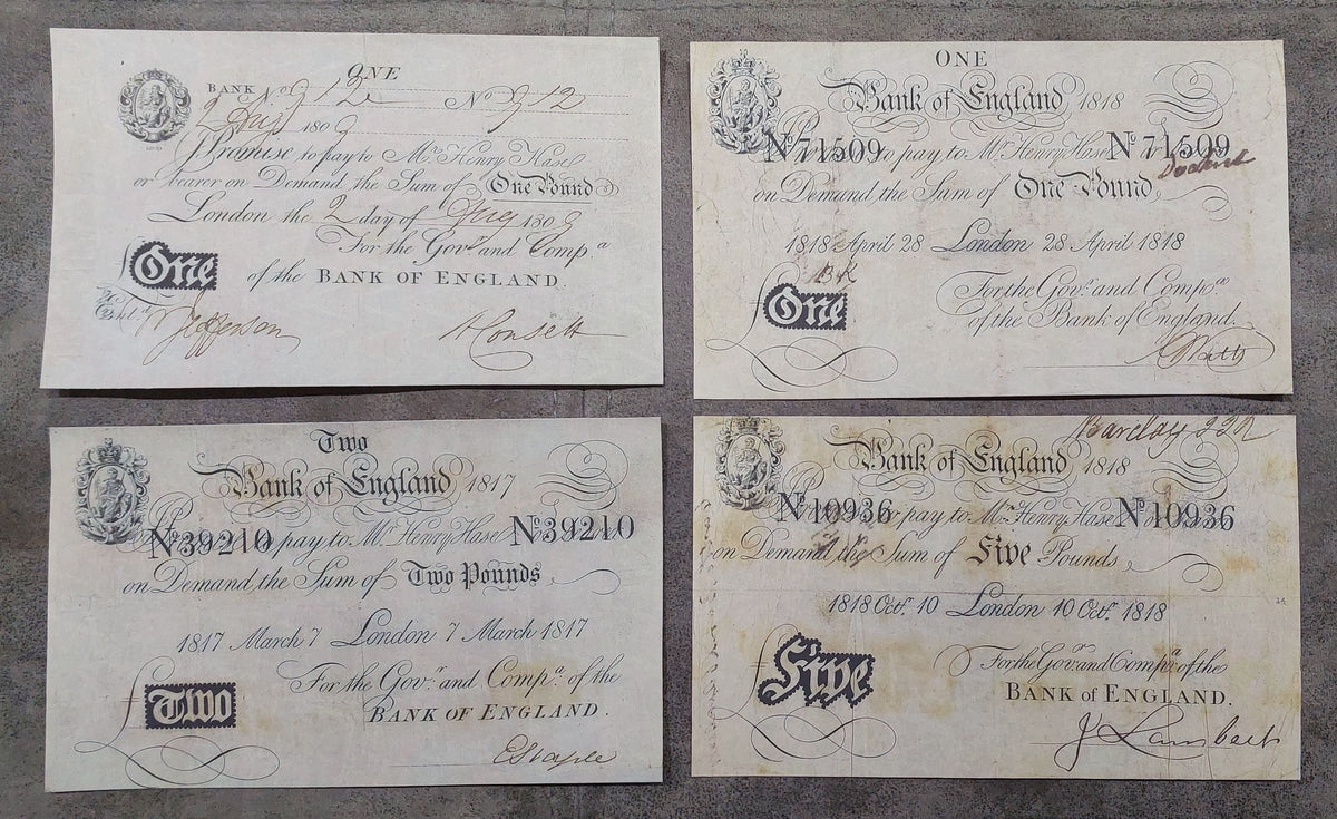Bank of England late Regency era paper currency featuring the 1817 2 Pounds, alongside the 1818 1 Pound and 5 Pounds denominations. Displays advanced early 19th-century security enhancements, bold border geometries, and classic London printing plate variations.