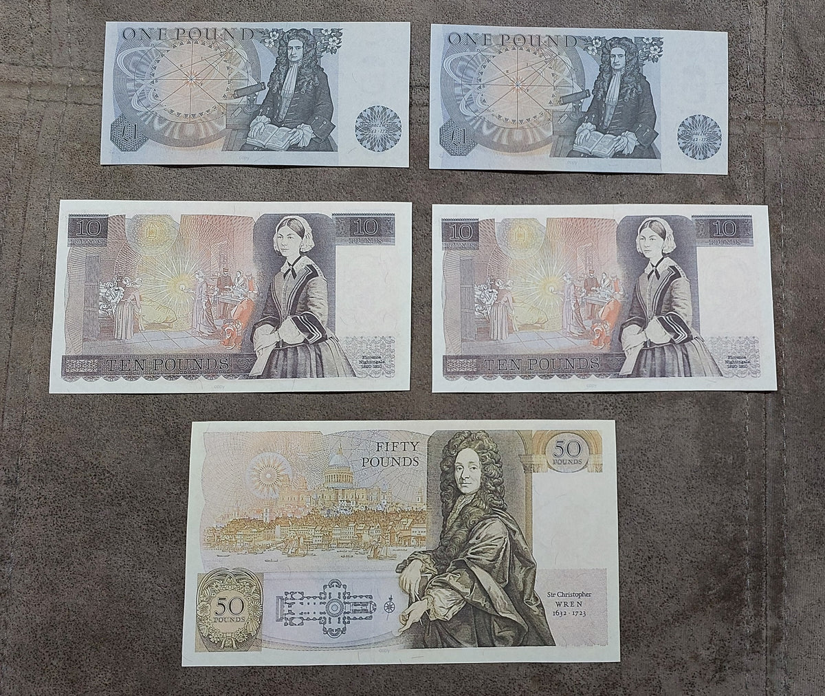 Four-note grid layout showcasing reverse side historical portraits and vignette designs (Duke of Wellington, George Stephenson) on the 5 Pound notes
