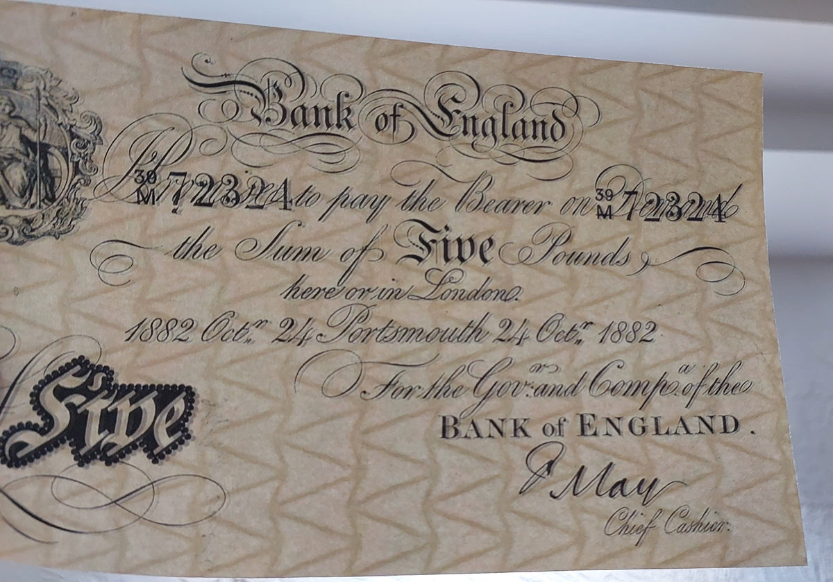Macro close-up of a Bank of England white promissory note. Highlights the incredible craftsmanship of the seated Britannia hand-engraved vignette, intricate legal promise text fonts, and classic London signature lines.