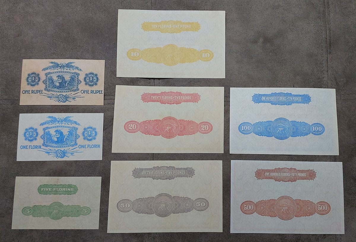 Multi-note grid arrangement showing the back/reverse side designs and center watermark windows across the collection