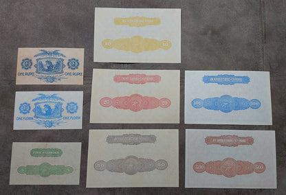 Multi-note grid arrangement showing the back/reverse side designs and center watermark windows across the collection