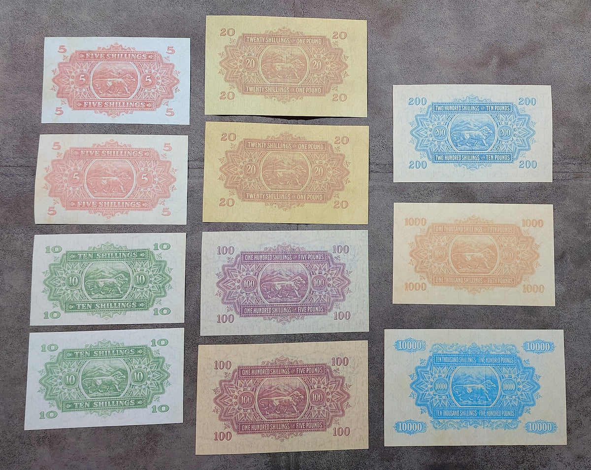 Full lot overview showcasing all 11 historical East African Shilling/Pound banknotes (1921–1933) arranged together back
