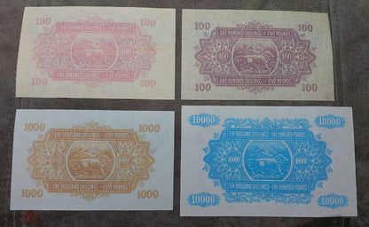 Four-note grid (quartet) displaying the detailed reverse/back side artwork and border designs of the Shilling notes.