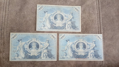  Reverse views of the Germany 100 Mark imperial paper currency varieties, showcasing complex anti-counterfeiting geometric lathe work, allegorical figures, and deep intaglio design contrast.