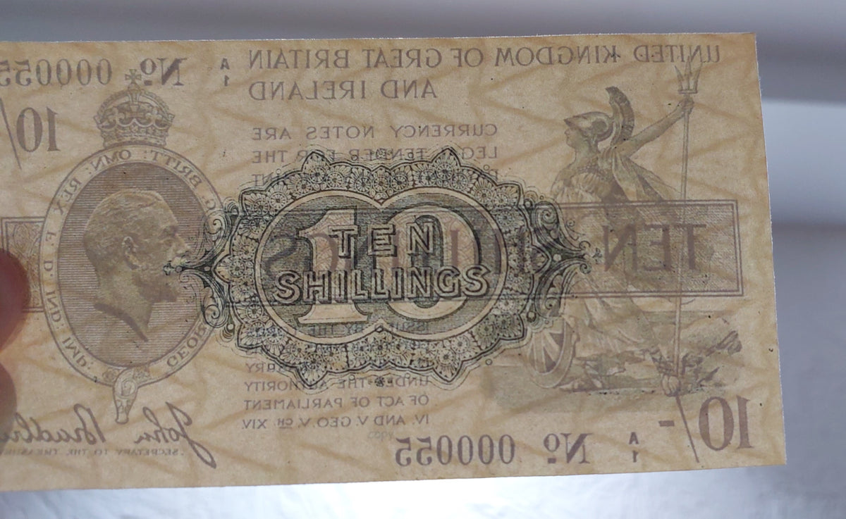 Rare World War I era British emergency treasury note specimen. Features heavy numismatic aging aesthetics, traditional security paper fibers, and classical United Kingdom fiscal engraving layouts for advanced grading analysis.