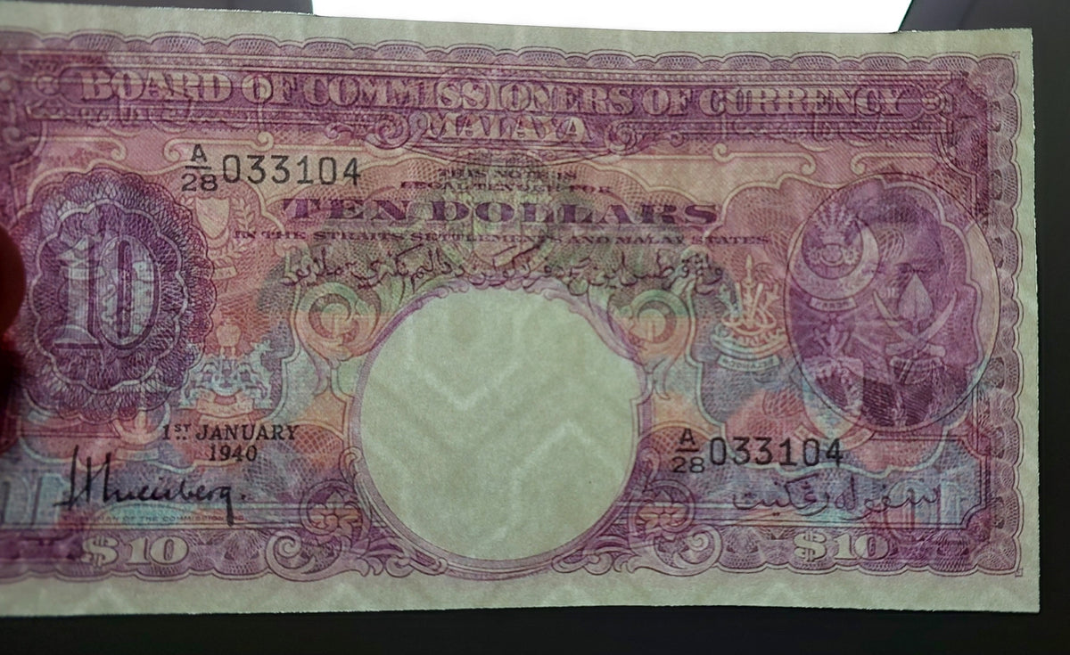 Detailed single-note close-up highlighting the obverse artwork, signature variety, and King George VI portrait on the 10 Dollar 1940 note
